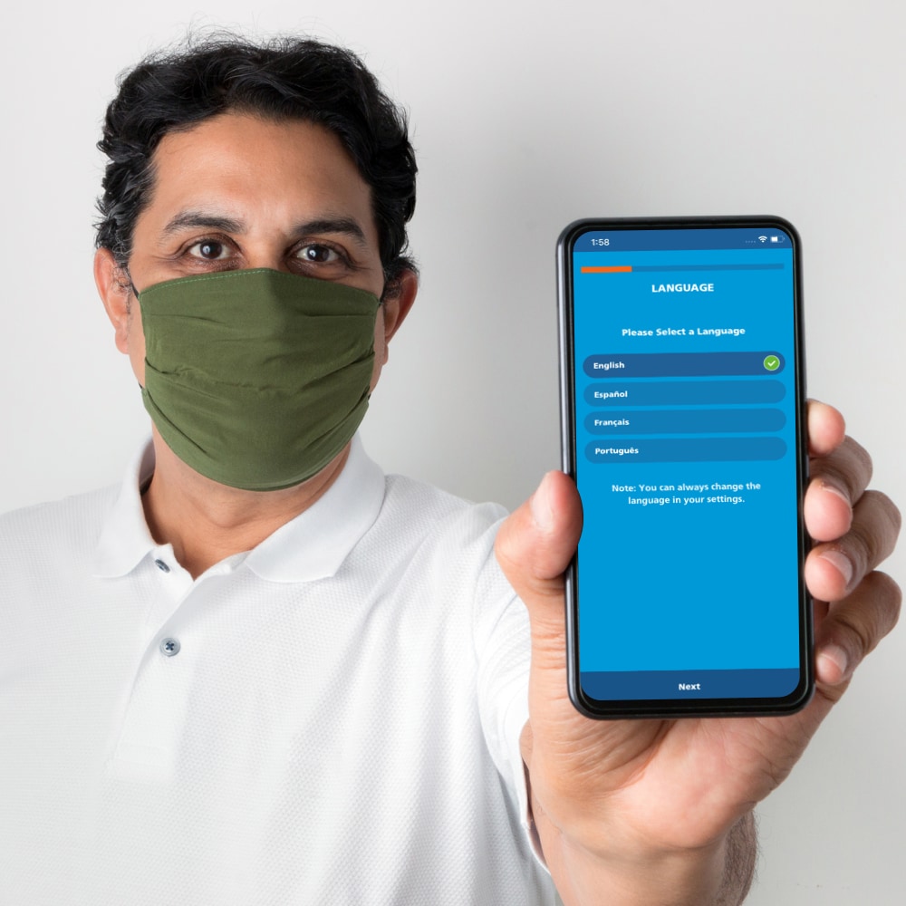person holding mobile phone with PPE app